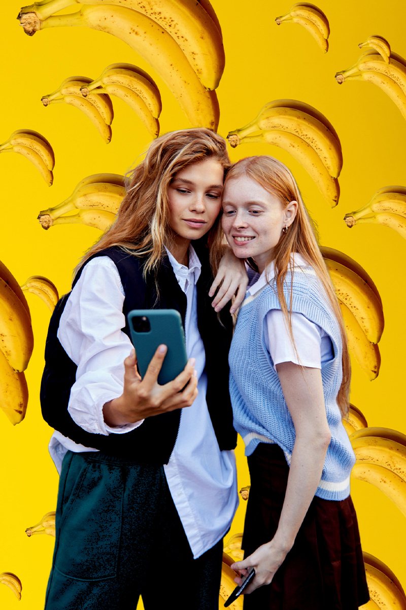 two women taking a selfie together with cool background