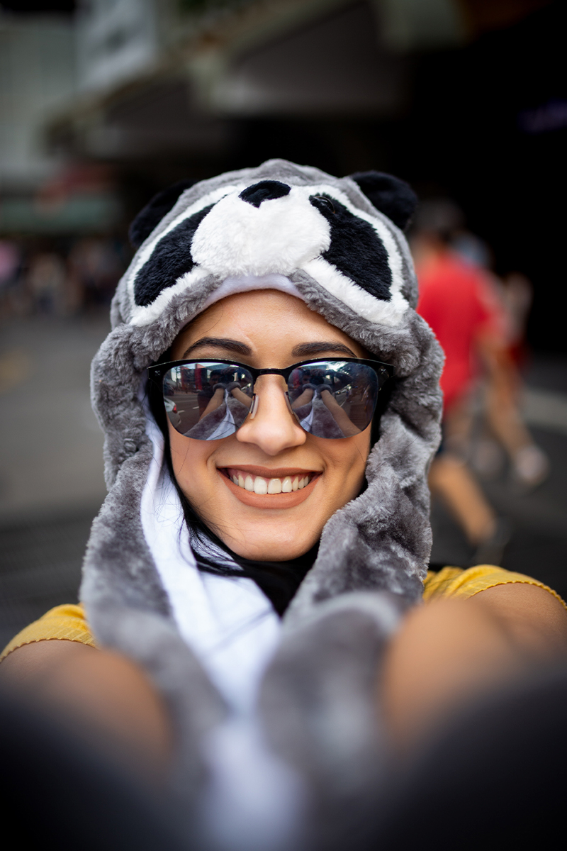 funky sunglasses selfie with woman wearing racoon hat