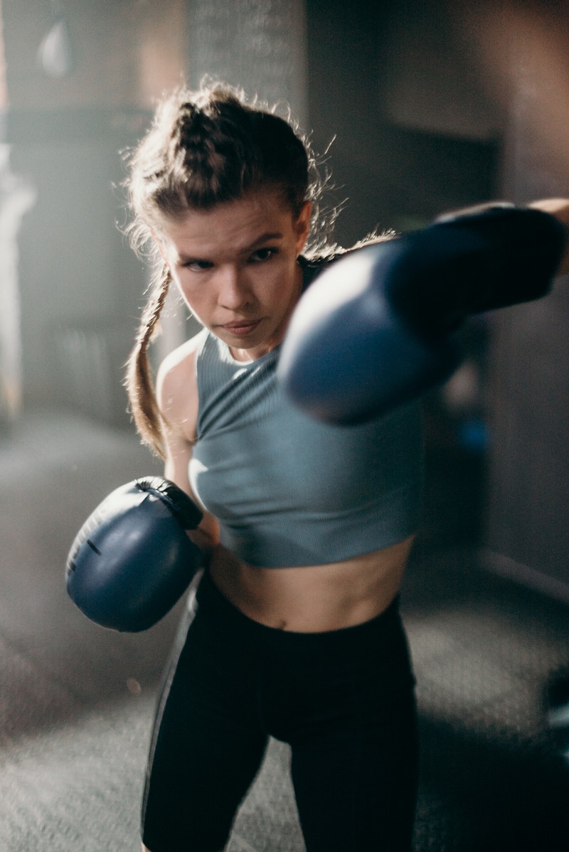 a female athlete practicing boxing